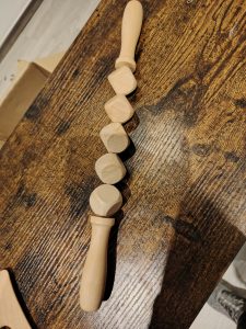Rouleau de massage en bois formé de des marque tulli